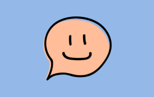 A blue background with an orange speech bubble with a smiley face inside