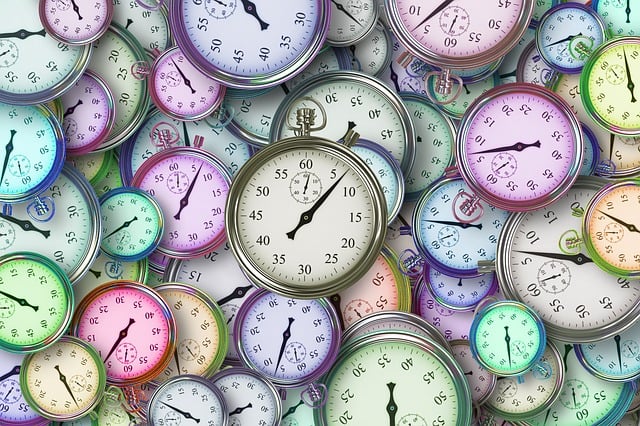 About 50 stopwatch faces in different pastel colours and sizes, all overlapping and different and all showing about 7 seconds.